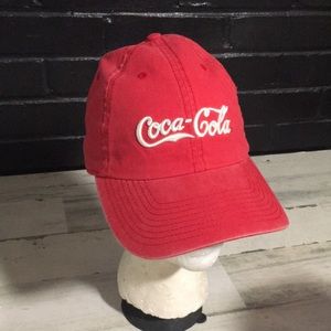 Coca-Cola red adjustable back ball cap with gold tone buckle and white emblem